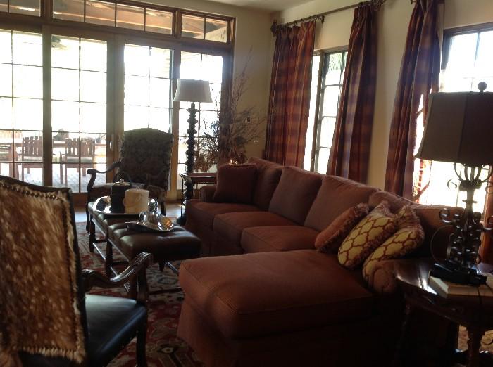 Thomasville sectional, leather tufted bench, Antelope skin chair, hand-woven Azadi rug