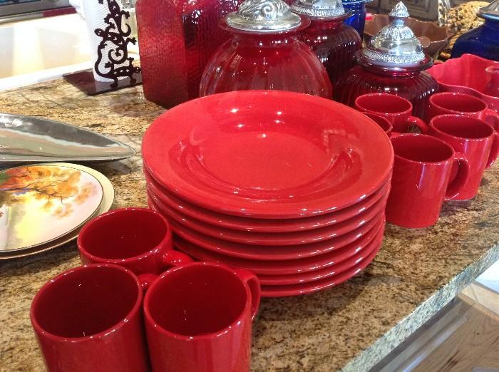 Assorted red china and glass cannisters