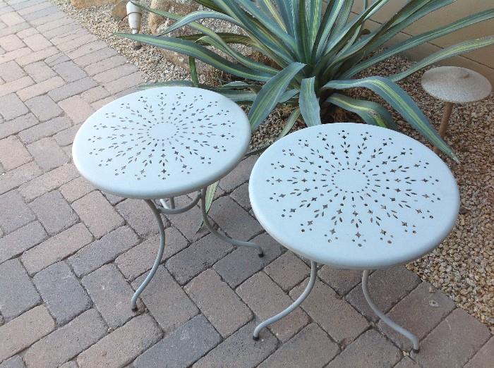 Two small metal round patio tables