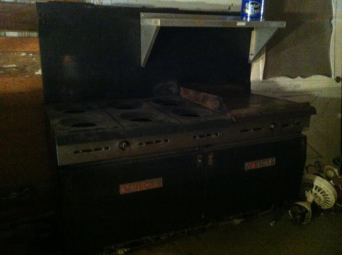 Vulcan double gave oven with six burners and griddle from a business.  Vulcans are built like battleships.   This one came out the local Two Doors Down Coffee shop.   This oven baked their famous buttermilk pie that was featured in an issue of O Magazine.   All the parts are here since removed from the Two Doors Down Location.  About 60 inch wide 60″ high