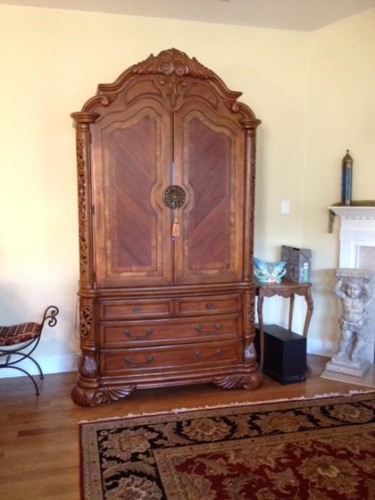 carved French style armoire to be used as TV, bar or wardrobe