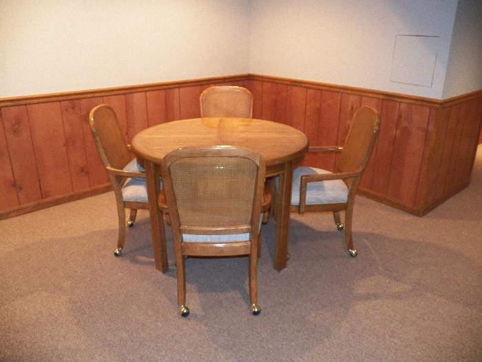 Oak Round Table with 4 Captain's chairs on rollers