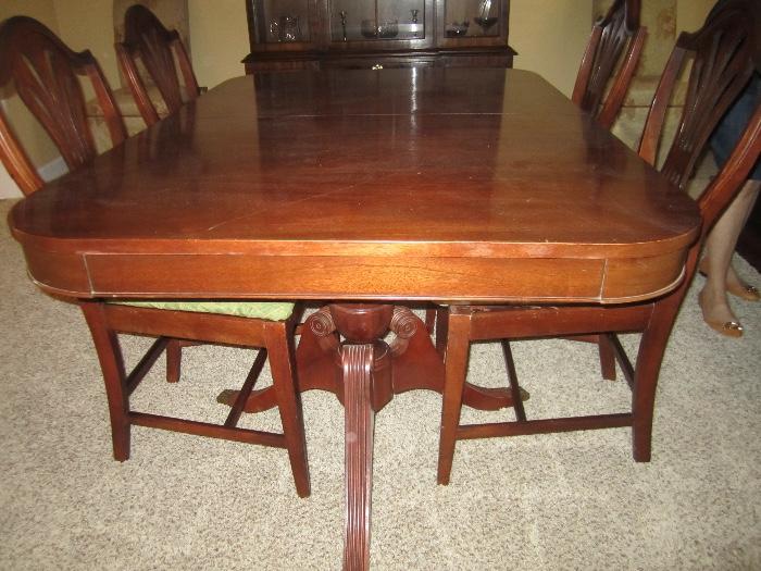 pedestal table and 6 chairs