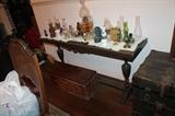 Antique late 19th century couch table with about 25 small oil lamps.