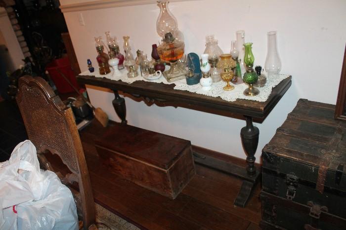 Antique late 19th century couch table with about 25 small oil lamps.  