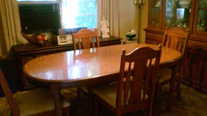 Large dinning table, chairs and Hutch