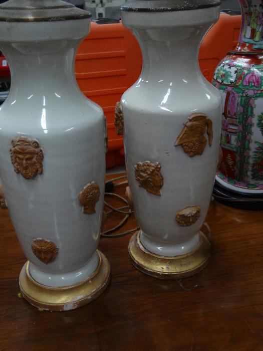 Pair of ceramic vases with masks