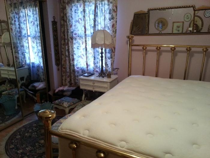 Standard size brass bed with a Sealy pillow top mattress 