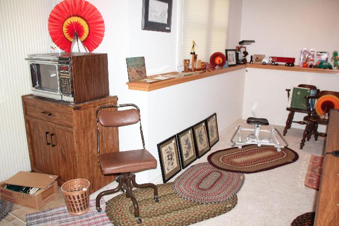 Elkhart Ind made desk chair, pictures, rowing machine, microwave and stand, yes....more rugs