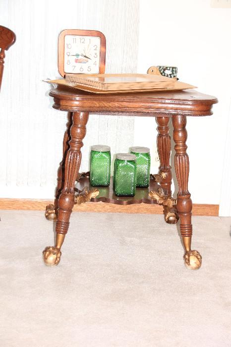 Oak Parlor table with glass ball and claw feet, Hoosier glass (?) jars