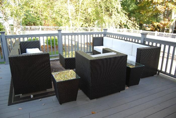11 piece outdoor furniture set including 3 tables and cushions.