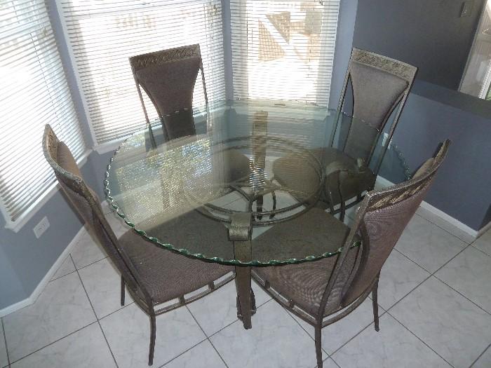 Kitchen table with 5 chairs (4 are shown).
