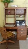 oak desk and vintage chair with rollers