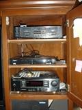 Entertainment center includes (2) Pioneer stereo speakers, Powered Yamaha subwoofer, Polk center speaker, Denon surround receiver, Yamaha tape deck.