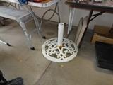 Heavy large cast iron umbrella holder.