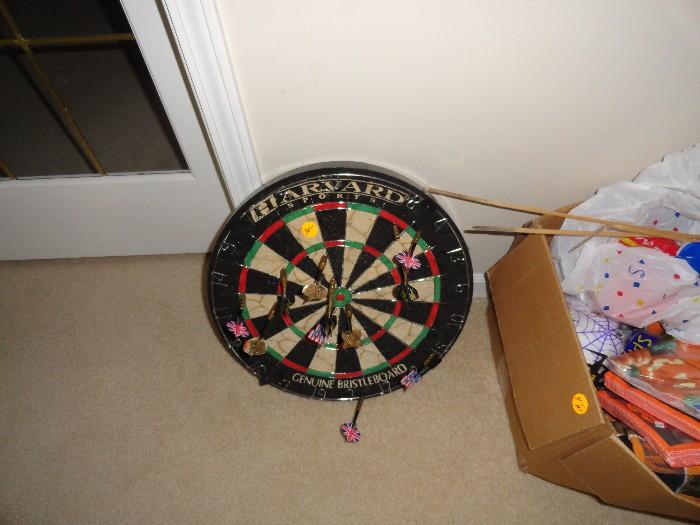 Thick heavy dart board with darts