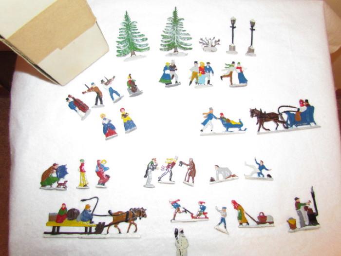 30 Vintage Hans Heinrichsen hand painted lead skaters from Germany. Each has the H or H/H mark for Hans Heinrichsen. These include the following:
Snowman
2 pine trees
2 lamp posts
1 bush
1 horse pulling a sleigh
1 horse pulling a delivery sled
Man pushing woman in a small sleigh
Various men skating, holding on to blowing hats, falling, etc.
Various women holding on to umbrella, pulling sled, skating, etc.
Musicians and carolers
Children throwing snow balls and riding on sleds
Skating couples 
Etc.
In the original box. Appear to never have been used.
We are also including a 13.5"D mirror to display this set on.
Excellent condition