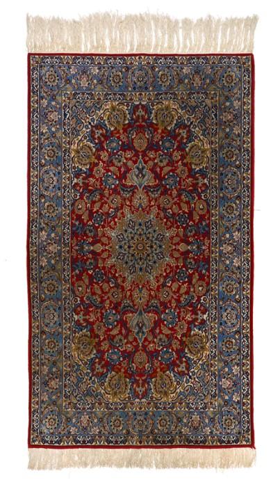 Lot 1006:  APPROX 30-45 YR. OLD PERSIAN HAND KNOTTED WOOL AND SILK RUG, 3'6'' x 5'8'': This very finely knotted rug has silk highlights like Nain or Qum quality rugs. The large red oval central ground of this rug has a much smaller blue, beige, and white snowflake shaped medallion in the center. The red ground is full of traditional motifs like palmettes, vases, flower heads, vines, and leaves in colors shades of blue, beige, red, white, and green. The ends of the main field have stylized palmettes of alternating colors that touch into the field but rest mainly on the white and blue corners. The blue and white borders blend in with the corners of the field and the last solid red band of color frames the rest. Condition is good.