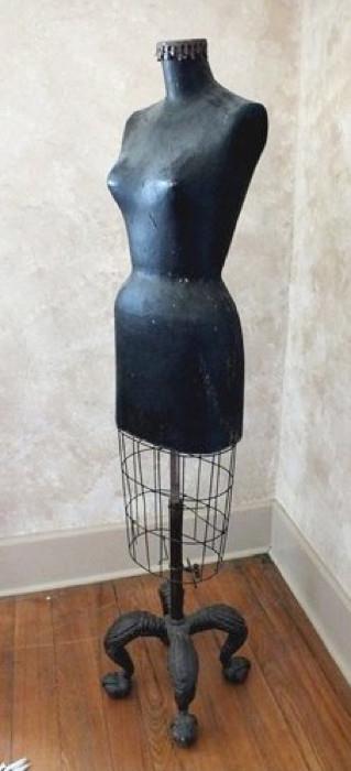 Vintage adjustable dress form with fiberboard upper torso and wire cage body featuring awesome cast iron base with ball and claw feet. Forms with this style base are hard to find. Size: 66"H x 13" x 13" base. Condition: Very Good for age.
