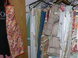 Large collection of vintage tablecloths & aprons