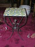 Vintage iron table with modernist tile top.