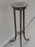 Antique wood plant stand with lion mask motif.