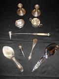 Great Room-"Smalls Area:"  Short sterling candleholders; silver-plate sugar and a sterling sugar; candle snuffer; two large spoons/scoops; MURANO glass bottle stopper; sterling handle shoe horn.