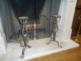 Great Room-Hearth:  Pair of antique heavy iron andirons.  Top is flat for placement of the iron kettle or pot. 