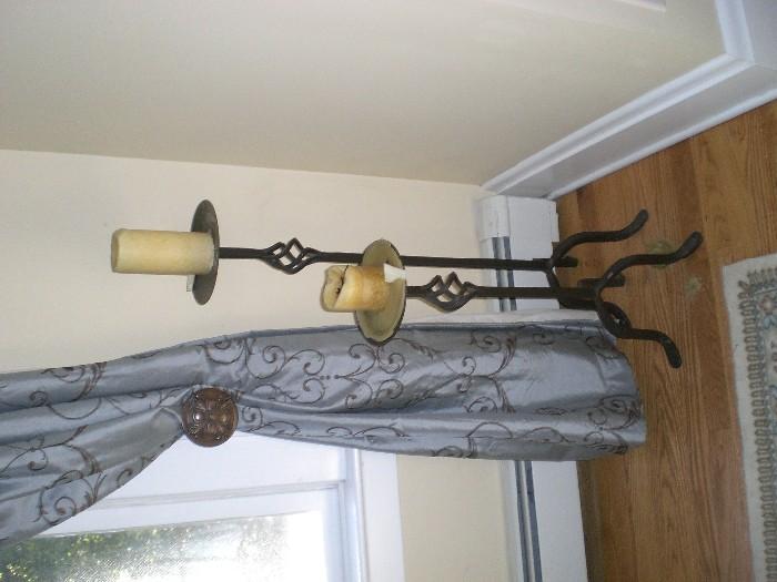 SET OF FOUR IRON STANDING CANDLE STICKS