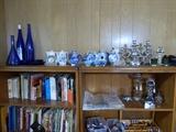 blue glass, teapots, candelabra, cookbooks, thimbles, spoons,  