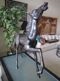 Bronze horse statue on lighted stand. Bought at antique show in 1990 at the Fountain Bleau Hotel in Miami.