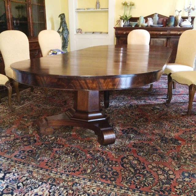 1008 - Mahogany Empire banquet table with six skirted leaves, scroll feet, 29 in. T 60 in. W 11 ft. L.