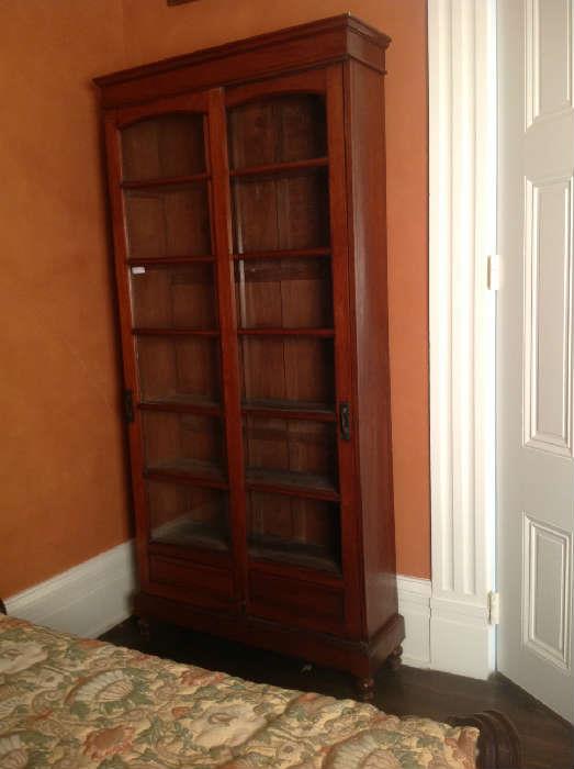 1033 - Match pair of walnut Victorian sliding door bookcases with peg construction, very large, 8FT5IN T, 4FT W, 14IN D