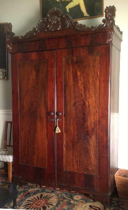 1182 - Mahogany two door Victorian wardrobe with heavily carved crown, 91IN T, 56IN W, 41IN D
