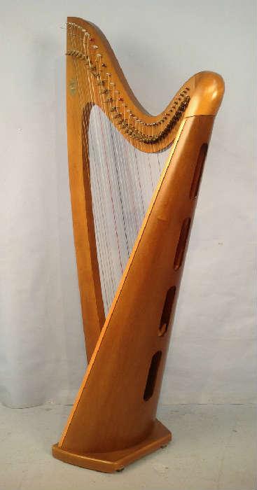 2017 - Lyon and Healy functional harp with cover and  carrying stand, 66 in.T, 30 in. W, 18 in. D.