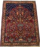 Lot#3004, KASHAN HAND WOVEN PRAYER RUG, C. 1900, W 2' L 2' 6"Scrolling floral bouquet in vase on a red ground, measuring L. 2 ft. 6 x 2 ft. Circa 1900.