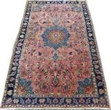 Lot#3010, BIJAR NORTHWEST IRAN HAND WOVEN RUG, C. 1910, W 4' 7" L 7' 5"Featuring a center medallion on a salmon color ground, decorated in all over animal figure and floral motif. Measuring L. 7 ft. 5 x 4 ft. 7. Circa 1910.