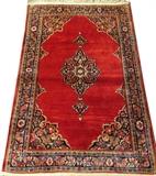 Lot#3049, SAROUK PERSIAN HAND WOVEN WOOL RUG, C. 1940, W 3' 1" L 4' 10"Having a central medallion on a red ground with canted corners. Measuring L. 4 ft. 10 x 3 ft. 1. Circa 1940.
