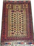 Lot#3070, BALUCH HAND WOVEN WOOL PRAYER RUG, C. 1890, W 2' 11" L 4' 7"Decorated with an all over stylized floral and foliate motif on a tan ground, with red and navy borders. Measuring L. 4 ft. 7 x 2 ft. 11. Circa 1890.