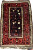 Lot#3078, BALUCH HAND WOVEN WOOL RUG, C. 1890, W 3' 3" L 4' 7"Decorated with an overall stylized floral motif on a dark blue ground, with a red border. Measuring L. 4 ft. 7 x 3 ft. 3. Circa 1890.