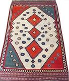Lot#3104, QASHQAI KILIM RUG, W 4' 7" L 7' 11"Having an ivory ground, with three saw-tooth medallions at the center, decorated in red, blue and black accents. Measuring L. 7 ft. 11 x 4 ft. 7.