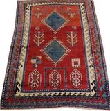 Lot#3119, CAUCASIAN KAZAK HAND WOVEN PRAYER RUG, C. 1890, W 3' 10" L 5'Featuring two central diamond form medallions on an orange red ground. Measuring L. 5 ft. x 3 ft. 10. Circa 1890.