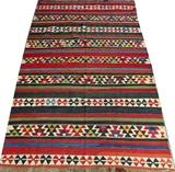 Lot#3128, CAUCASIAN SHIRVAN KILIM RUG, C. 1890, W 4' 11" L 8' 2"Flat woven rug, decorated with a repetitious geometric pattern, with alternating stripes of burgundy, red, and blue. Measuring L. 8 ft. 2 x 4 ft. 11. Circa 1890.