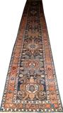 Lot#3159, PERSIAN HAND WOVEN WOOL RUNNER, 3' 1" X 19' 7".With a navy ground.