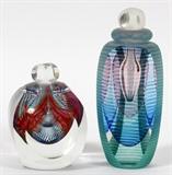 Lot#73, MICHAEL DAVID & KIT KARBLER, ART GLASS PERFUME BOTTLES, C. 1981, 2 PCS, H 3 1/2" & 5"Including two art glass perfume bottles by Michael David & Kit Karbler, one of which is dated '81. Each feature frosted glass sides, internally decorated with linear abstract designs. Measuring H. 3 1/2" and H. 5 5/8".