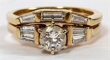 Lot#104, 18KT YELLOW GOLD AND 1.49 CTW DIAMOND ENGAGEMENT RING AND WEDDING BAND//engagement ring having a 0.61ct center round cut diamond, prong set, flanked on each side by two tapered baguette diamonds weighing 0.31 ctw. Having an "H" color and SI 2 clarity (see Charles Kent Reaver Co. Inc. appraisal dated, 11/18/99, also one 18kt yellow gold wedding band set with three baguette diamonds, two tapered and one straight equaling 0.58 ctw. Having a "G" color and "VS1" - "VS2" clarity (See Charles Kent Reaver Co. Inc. 10/17/2000.