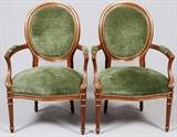 Lot#139, ISENHOUR LOUIS XVI STYLE OPEN ARMCHAIRS, PAIR, H 41"A pair of open armchairs in the Louis XVI style by Isenhour Furniture. Partial gilt decorated frames, with upholstered seats, backs, and arms in a green velvet with brass upholstery nail trim. Raised on tapering fluted legs, measuring, H. 41" x 26 1/2". Late 20th Century.