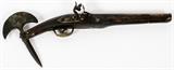 Lot#268, PERSIAN MIDDLE EASTERN FLINT LOCK PISTOL WITH INTEGRAL AXE HEAD AND SPIKE, L 10" BBL//Pistol mounted with axe head and spike at the butt. Decorated with inlaid gilt metal in a swirl form design along the stock. Measuring L. 19" overall.