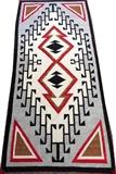 Lot#1327, NAVAJO HAND WOVEN RUG, C. 1920, 6' 8" X 3' 0"Having a double arrow form central medallion on an ivory ground, with a gray border. Measuring L. 6 ft. 8 x 3 ft. Circa 1920.