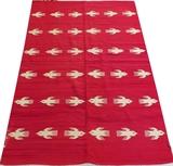 Lot#1329, NAVAJO HAND WOVEN RUG, C. 1900, 7' 0" X 4' 6"Having an all over repetitious bird in flight motif on a red ground. Measuring L. 7 ft. x 4 ft. 6. Circa 1900.
